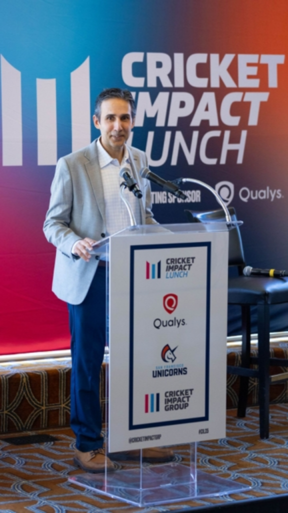Zee Zaidi of CricExec speaking at the podium during the Cricket Impact Lunch 2025, addressing the role of cricket in business and community engagement.