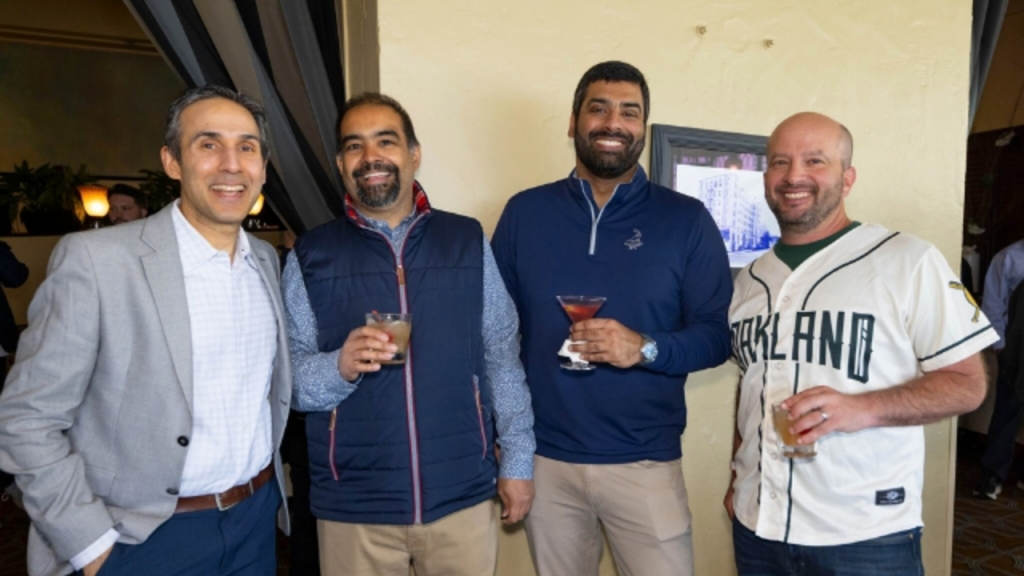 Zee Zaidi posing with guests during a networking session at the Cricket Impact Lunch 2025, highlighting camaraderie and community around cricket leadership.
